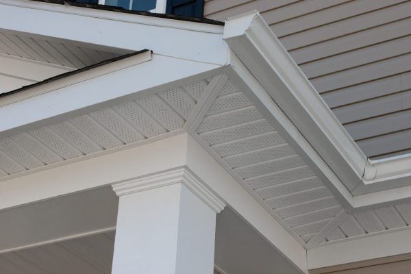 Colonial white custom porch columns with wood looking vinyl column wrap, sheets and molding, white soffit provides optimal ventilation for roof overhangs