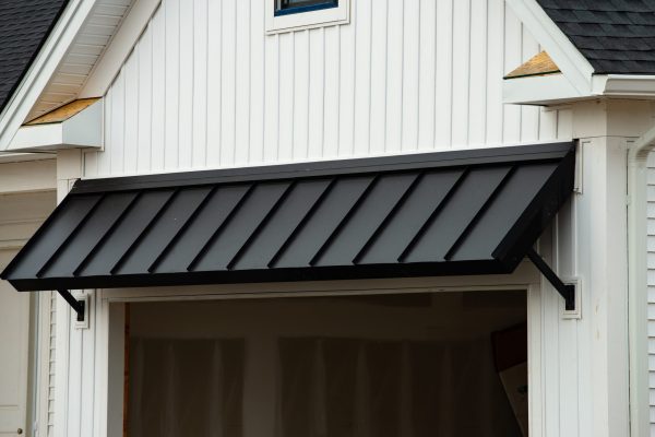 metal roof against the wall of building visor
